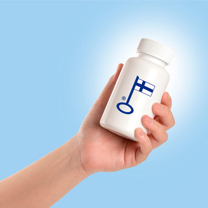 Kotimainen ravintolisäpurkki kädessä ja Avainlippu-merkki